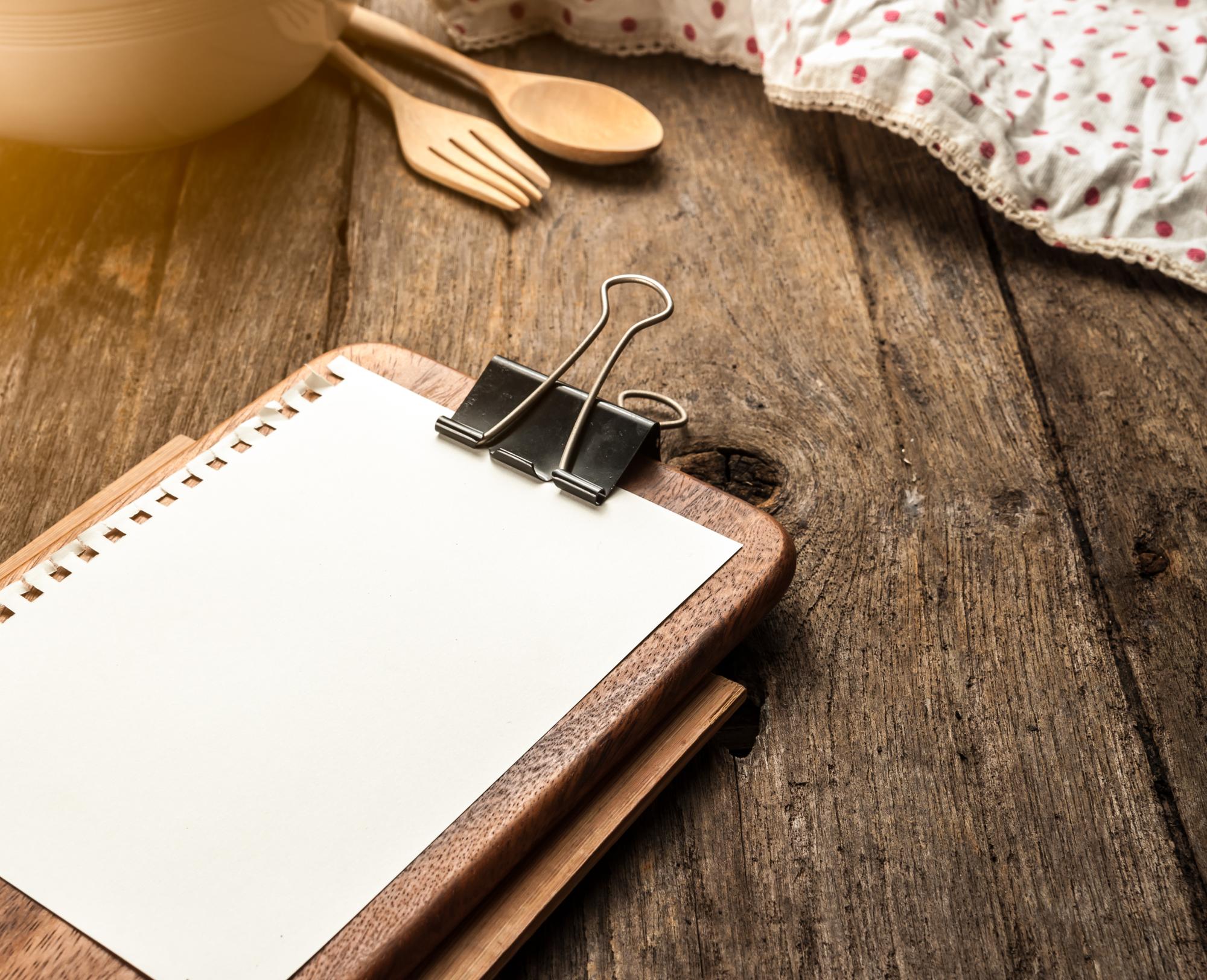 Notepad and tasting notes on wooden table
